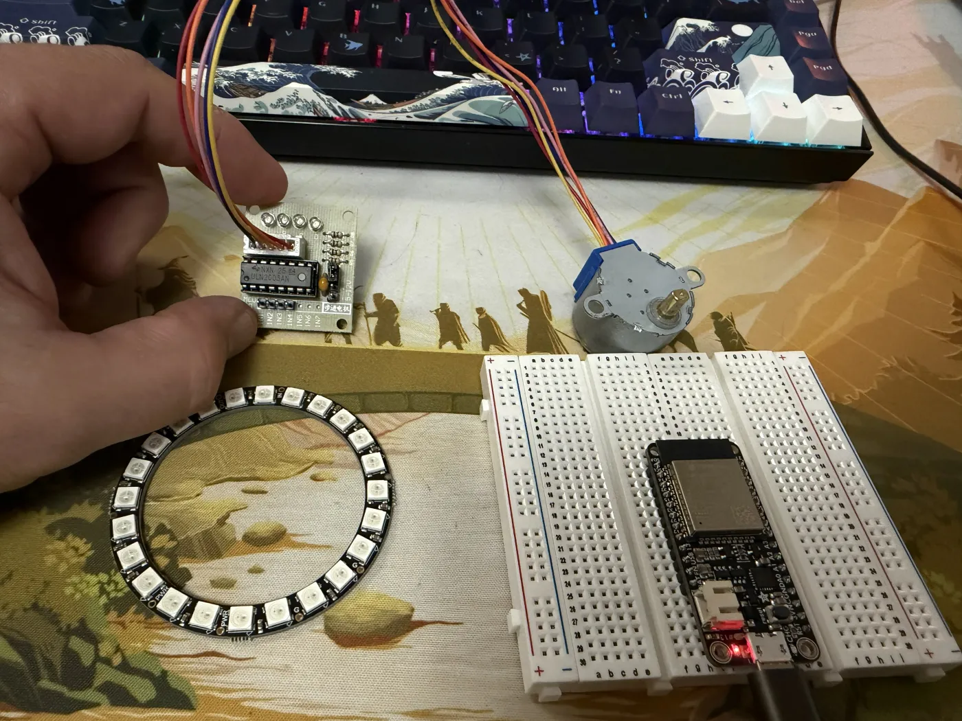 Adafruit HUZZAH32 ESP32 seated on a white breadboard with a USB cable connected, freshly flashed and running firmware