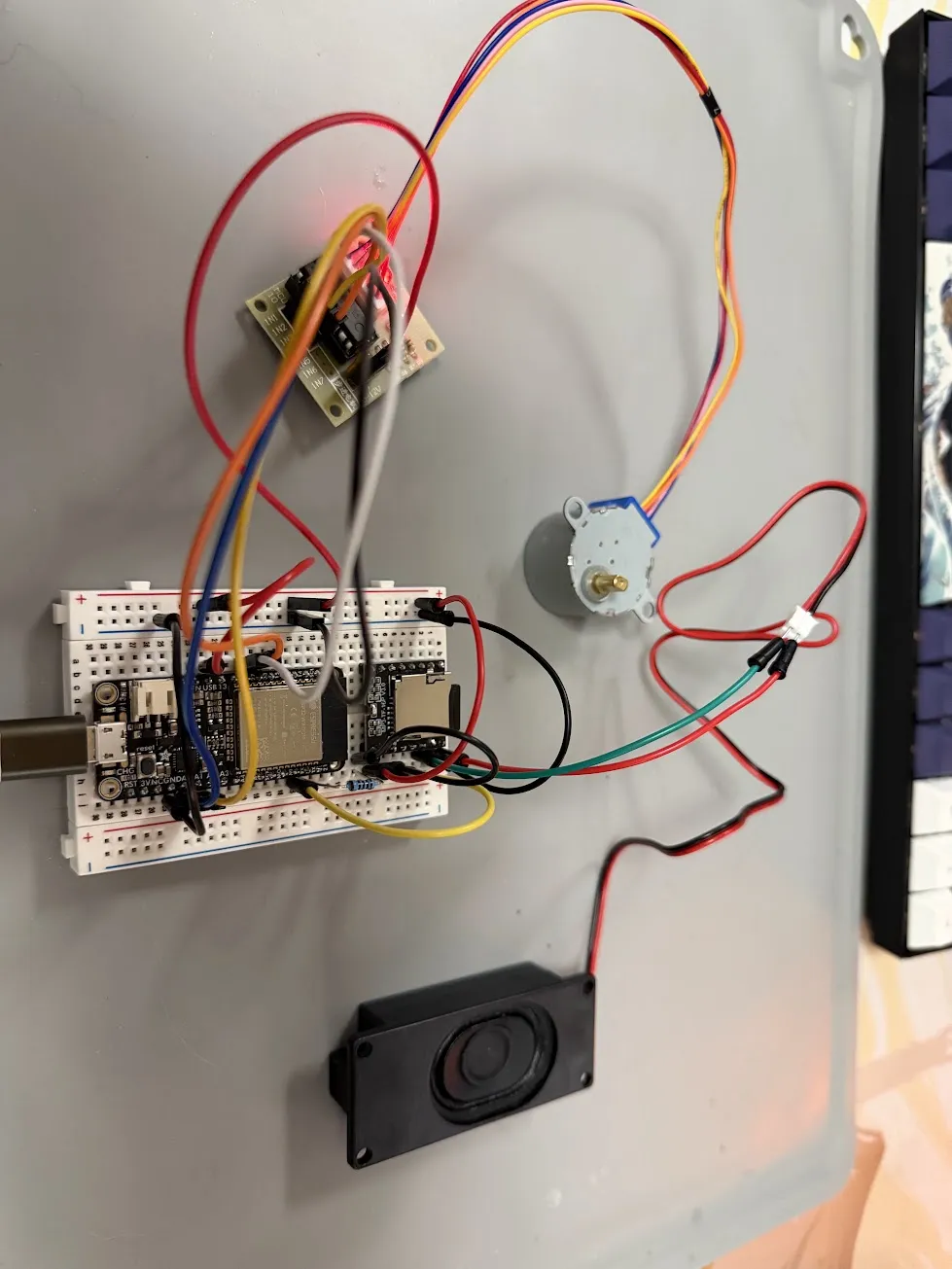 The full compass prototype mounted vertically, showing all three systems wired together and running